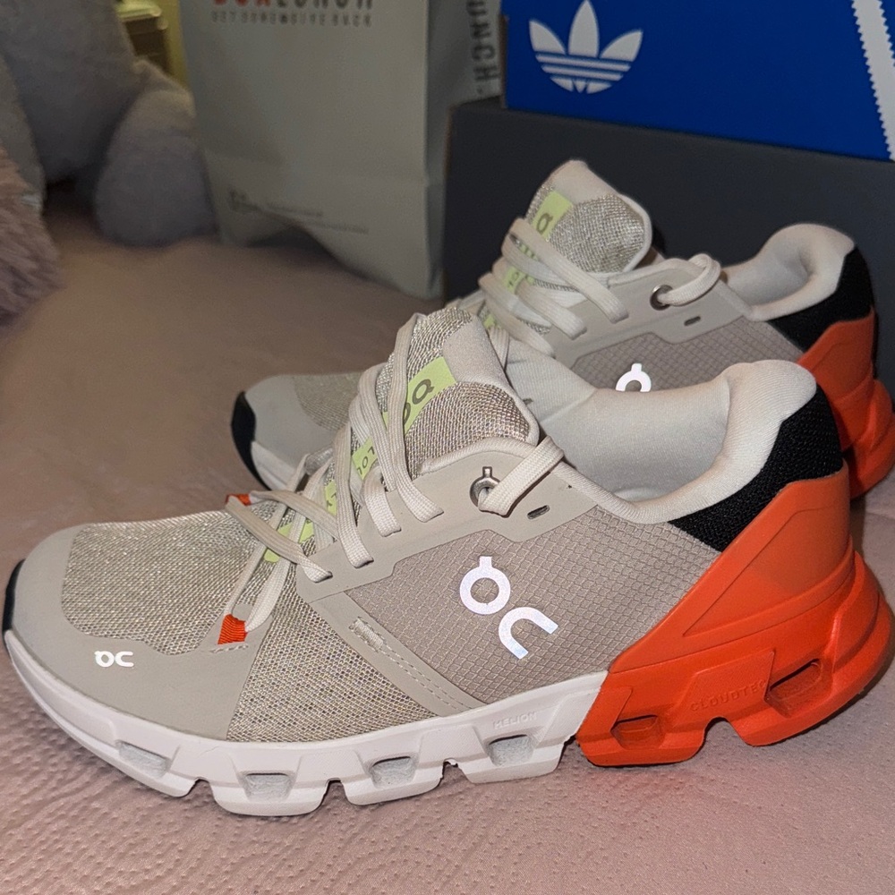 On Running Shoes in Cream and Bright Orange